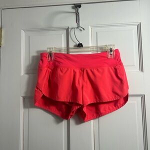 Lululemon Speed Up shorts in a carnation red